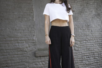 Liv wearing Nike Cortez, Forever 21 black red palazzo track pants, cropped t-shirt and quay sunglasses