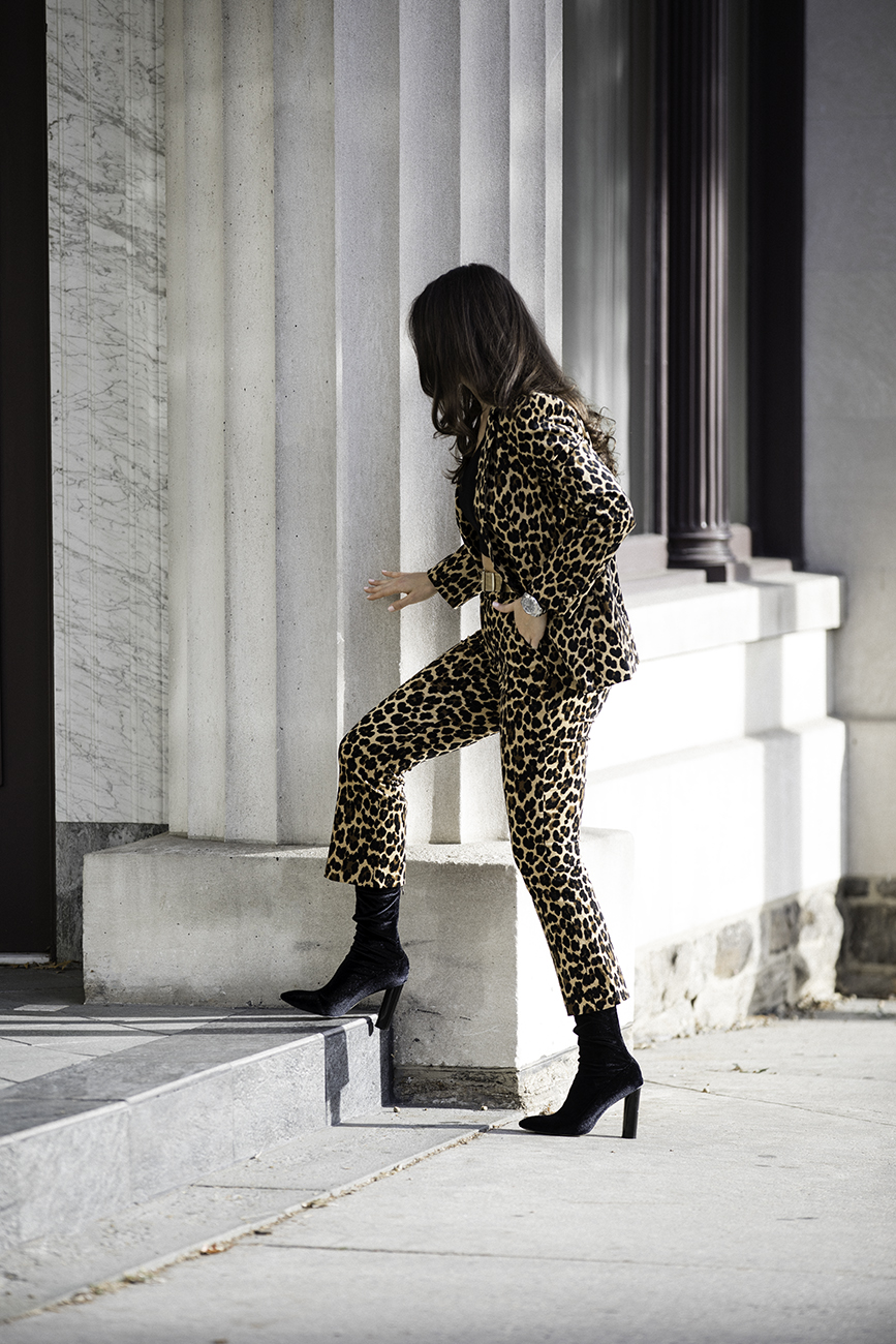 Liv Micheli is in Greenwich, CT wearing the Frame Cheetah Velveteen Classic Blazer, Frame Cheetah Velveteen Flare pants, Are You Am I Ling Top, Vintage Gold Mesh Belt from Etsy, and Public Desire Velvet boots. 