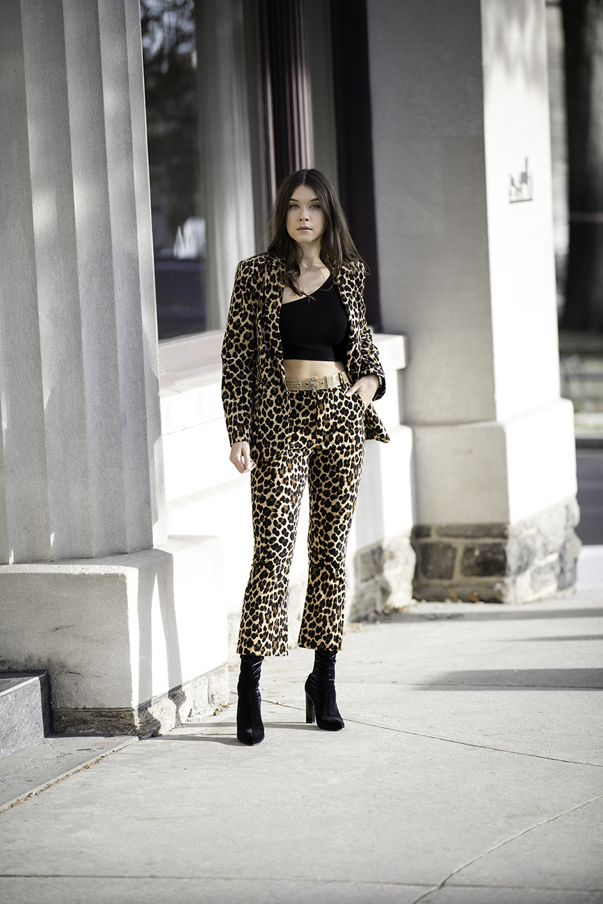 Liv Micheli is in Greenwich, CT wearing the Frame Cheetah Velveteen Classic Blazer, Frame Cheetah Velveteen Flare pants, Are You Am I Ling Top, Vintage Gold Mesh Belt from Etsy, and Public Desire Velvet boots. 