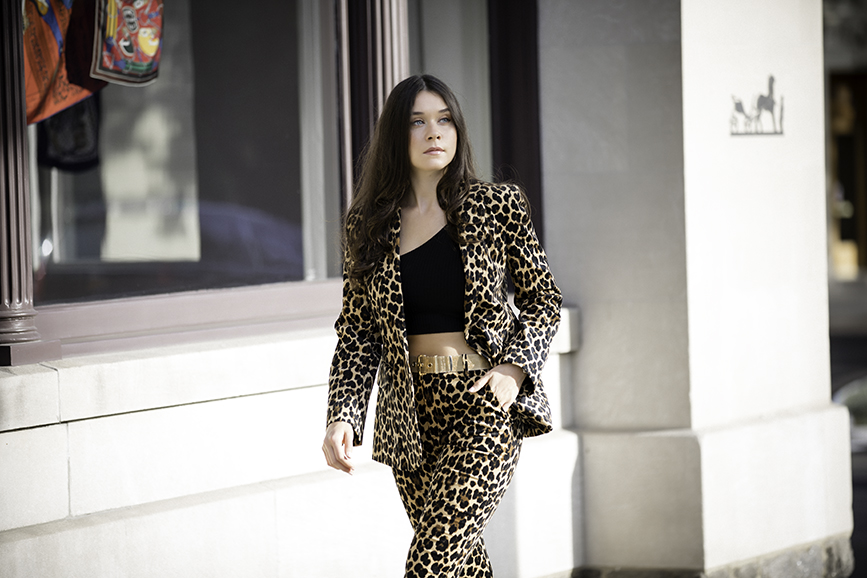 Liv Micheli is in Greenwich, CT wearing the Frame Cheetah Velveteen Classic Blazer, Frame Cheetah Velveteen Flare pants, Are You Am I Ling Top, Vintage Gold Mesh Belt from Etsy, and Public Desire Velvet boots. 