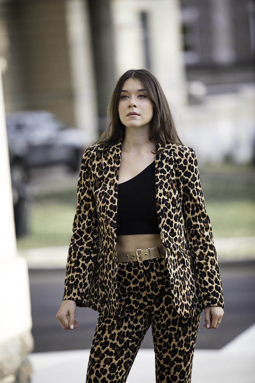 Liv Micheli is in Greenwich, CT wearing the Frame Cheetah Velveteen Classic Blazer, Frame Cheetah Velveteen Flare pants, Are You Am I Ling Top, Vintage Gold Mesh Belt from Etsy, and Public Desire Velvet boots. 