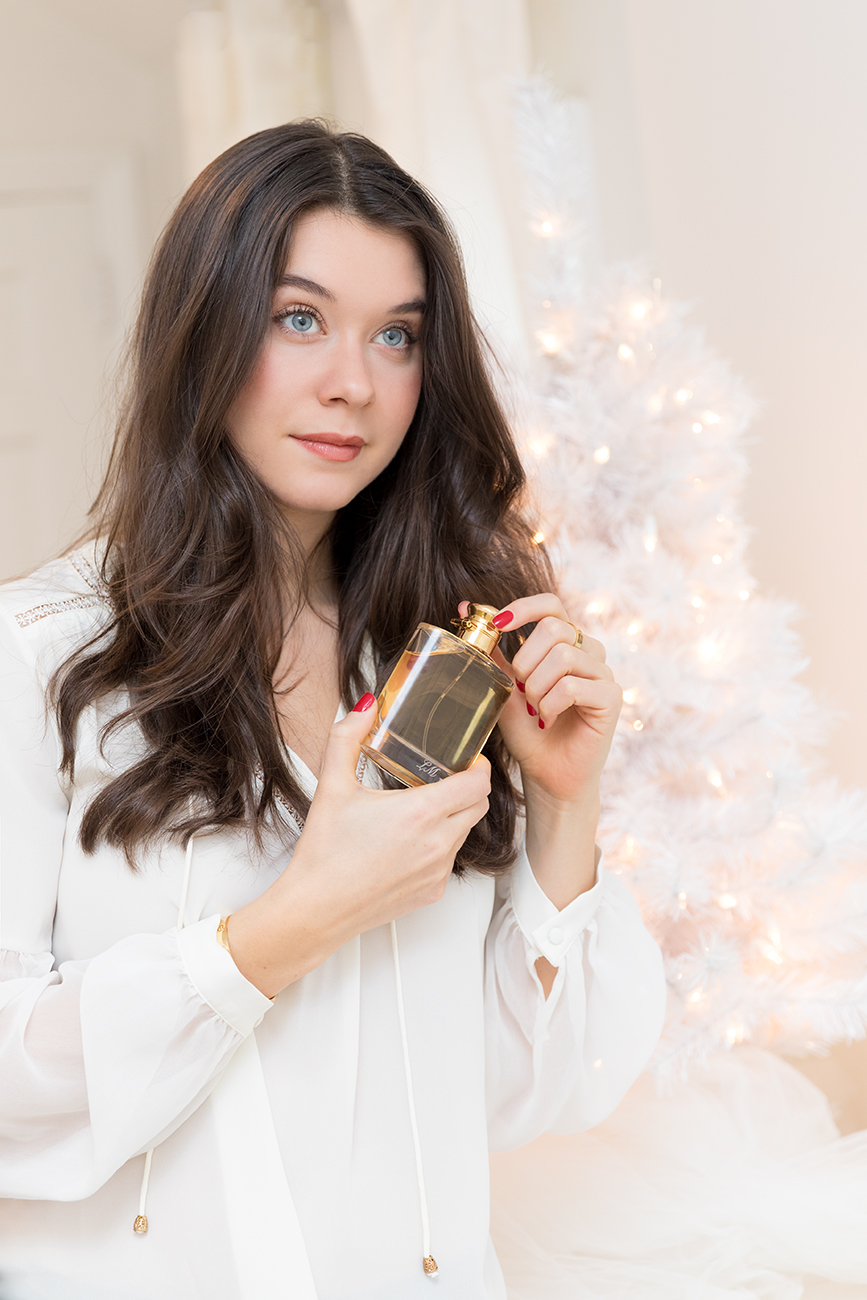 Liv Micheli, the creator of the blog Liv For Luxury, with the new Ralph Lauren WOMAN fragrance and wearing a Heartloom top.