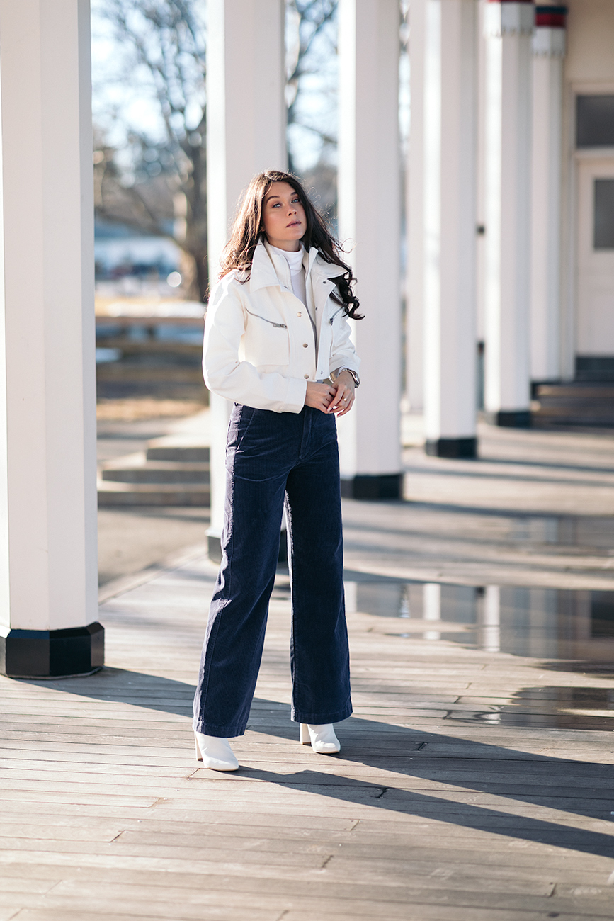 10 cropped jackets to ease you into spring liv for luxury liv micheli wearing polo Ralph Lauren corduroy pants, I.AM.GIA Icepere jacket, Wolford Colorado bodysuit and Stuart Weitzman white boots.