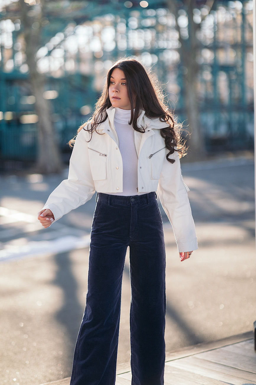 20 cropped jackets to ease you into spring liv for luxury liv micheli wearing polo Ralph Lauren corduroy pants, I.AM.GIA Icepere jacket, Wolford Colorado bodysuit and Stuart Weitzman white boots.